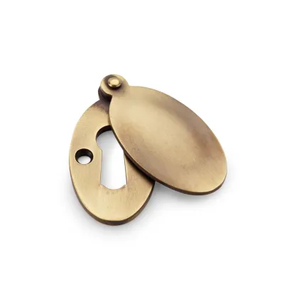 Alexander and Wilks Ellipse Escutcheon with Harris Design Cover - Antique Brass